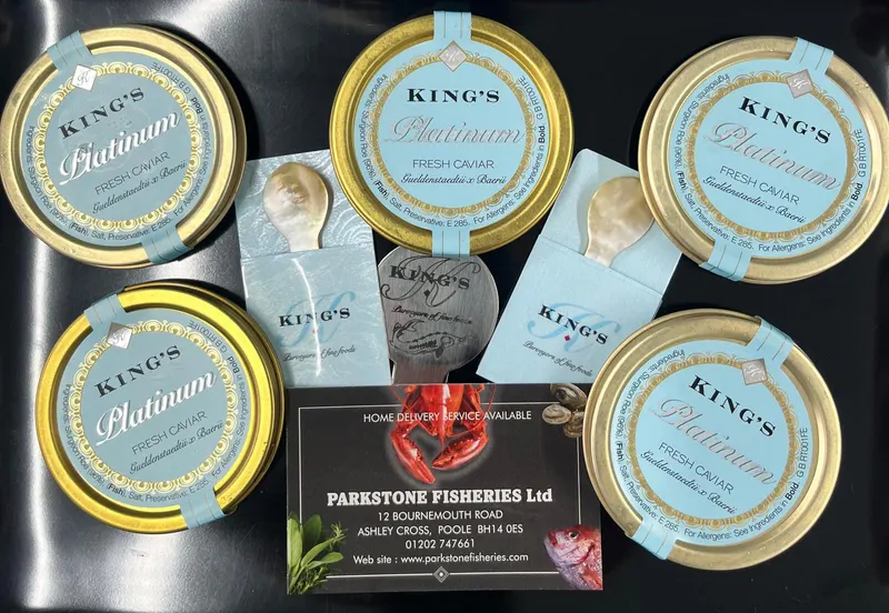 Tins of King's Platinum fresh caviar with mother of pearl spoons