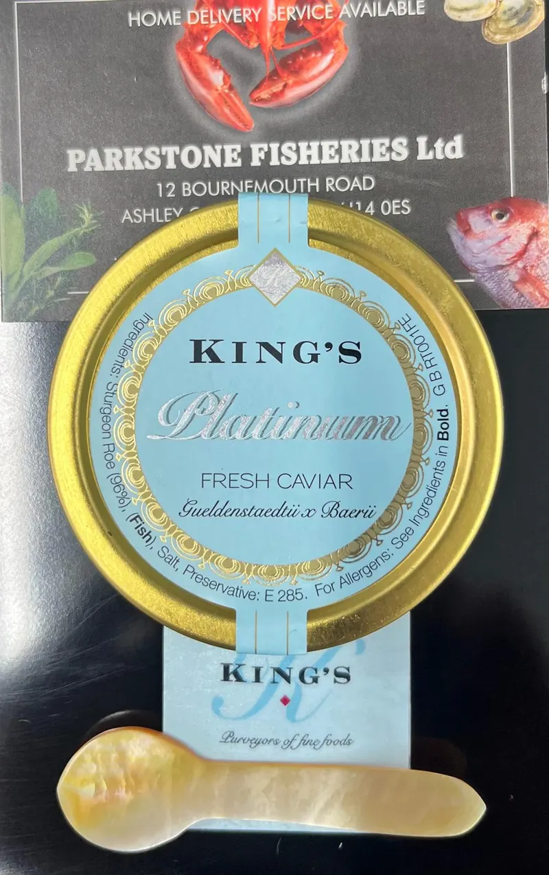 A tin of King's Platinum fresh caviar with a mother of pearl spoon