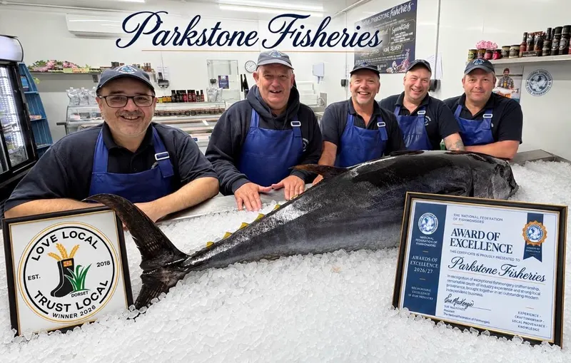 The Parkstone Fisheries team behind the counter with a whole bluefin tuna on ice