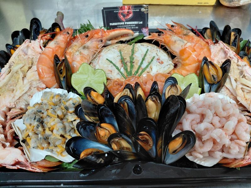 Seafood platter ringed with mussels around hand-dressed crab, with king prawns, cockles and peeled prawns, Parkstone Fisheries, Poole