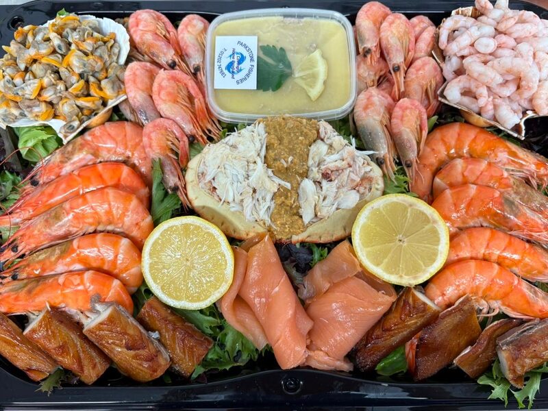 Seafood platter of king prawns, hand-picked crab, smoked fish, peeled prawns and lemon, Parkstone Fisheries, Poole
